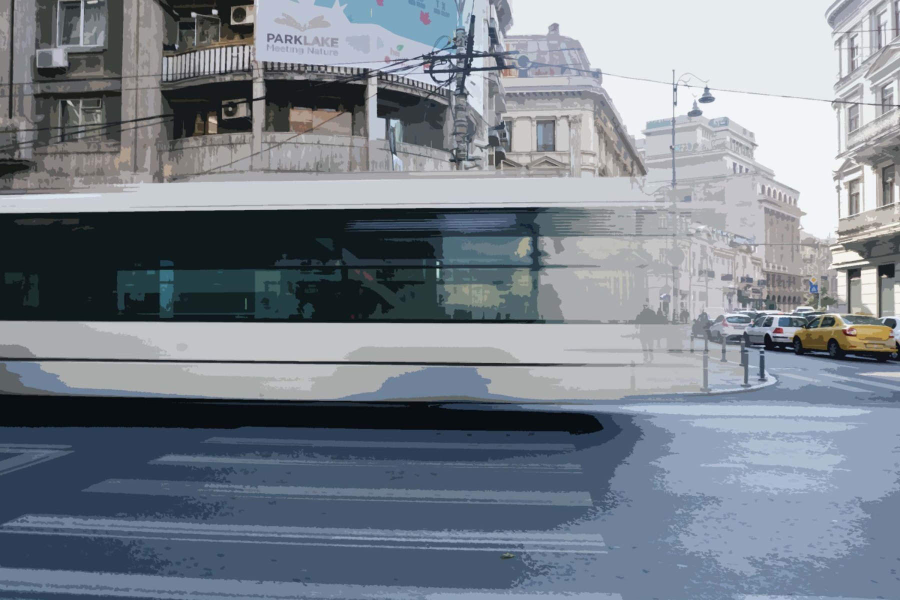 Image of Bucharest, Romania. A large white bus drives past in a whirl and large buildings are in the background. The street in the foreground are empty, and one man looks transparent and diminutive in the background